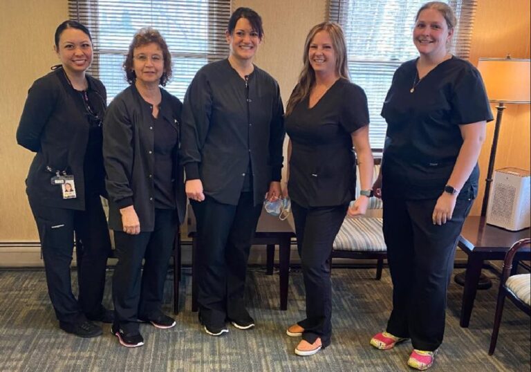 5 MFD dental assistants standing in lobby